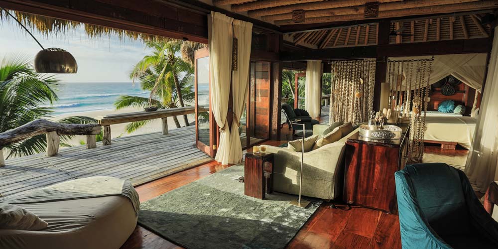 oceanfront Presidential Villas blend seamlessly into the jungle
